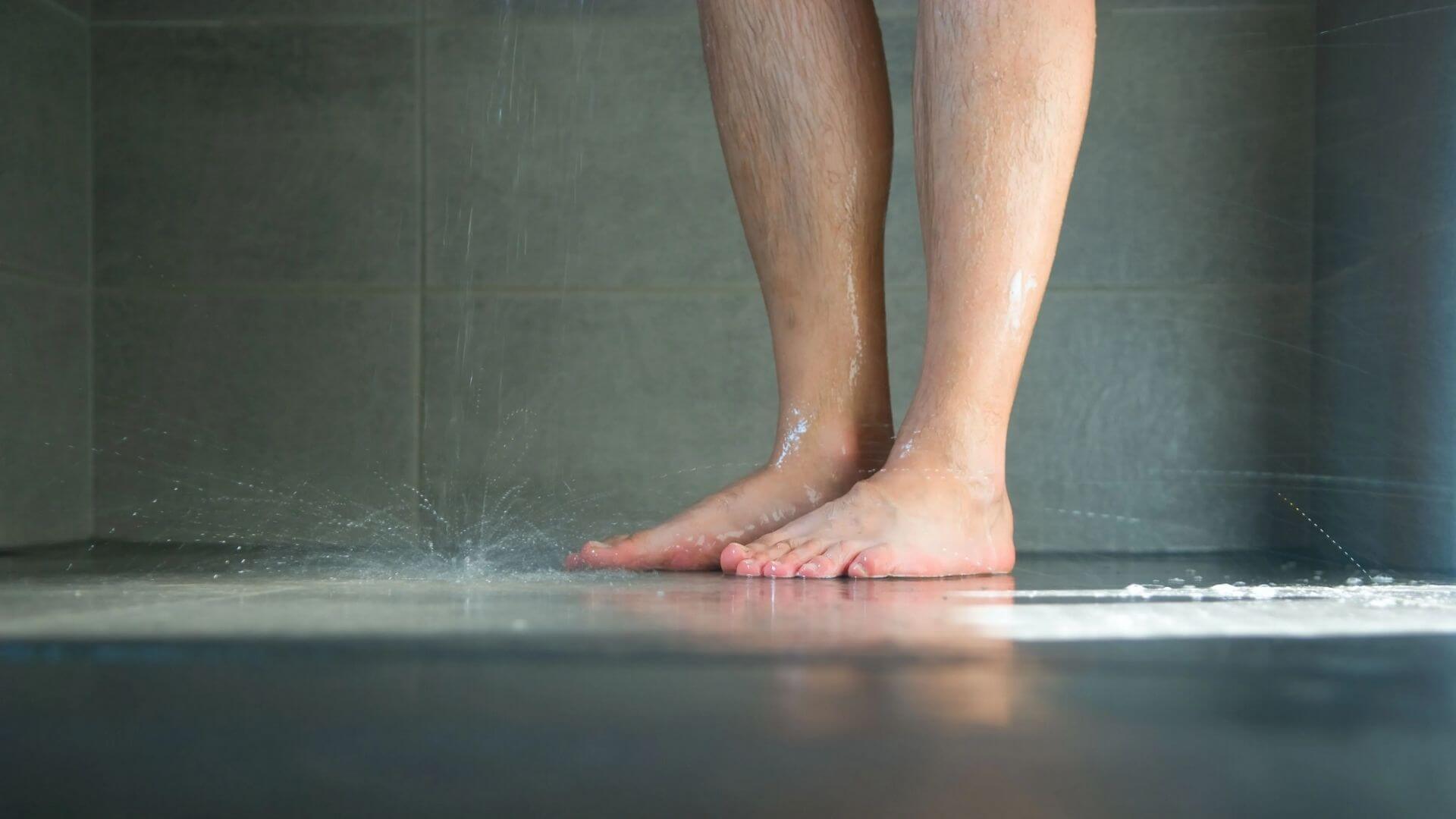 Persons Legs Standing In Shower