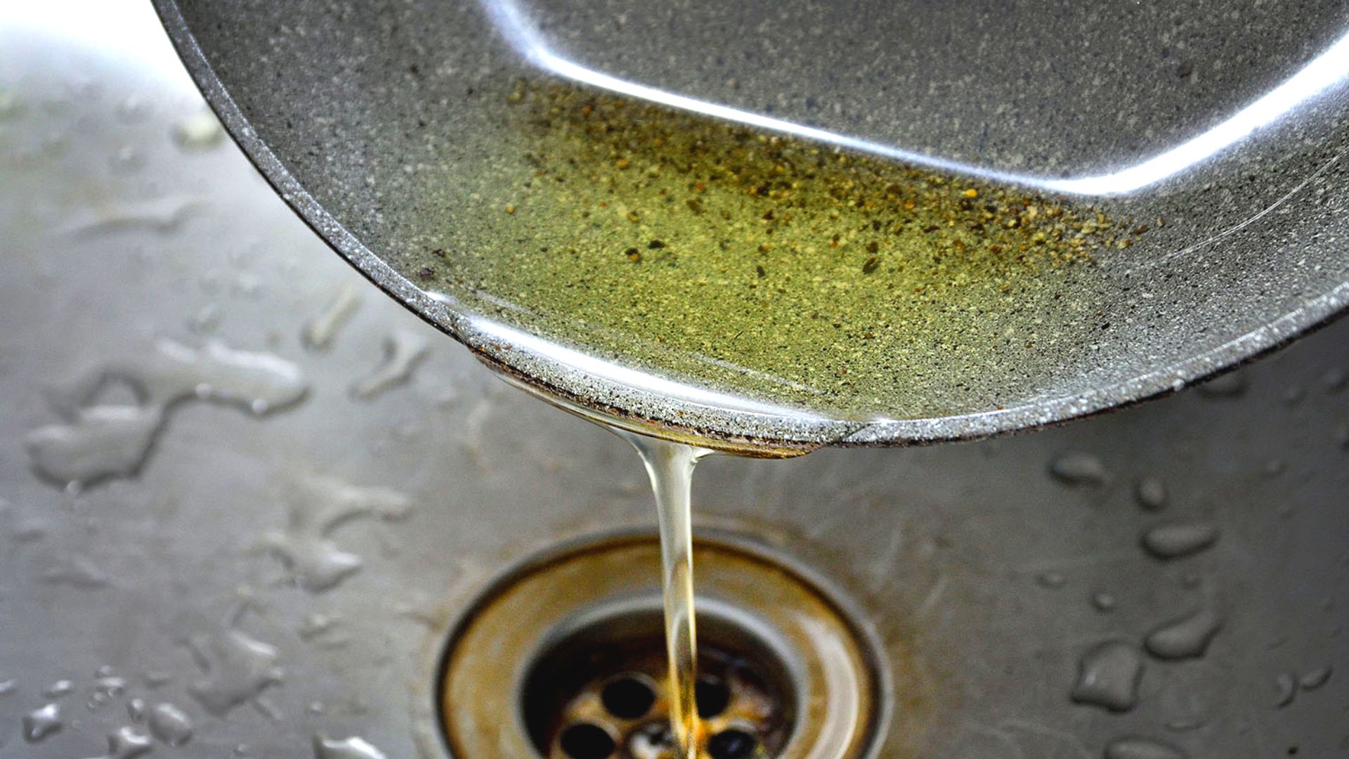 Pouring Oil From Pan Down Sink