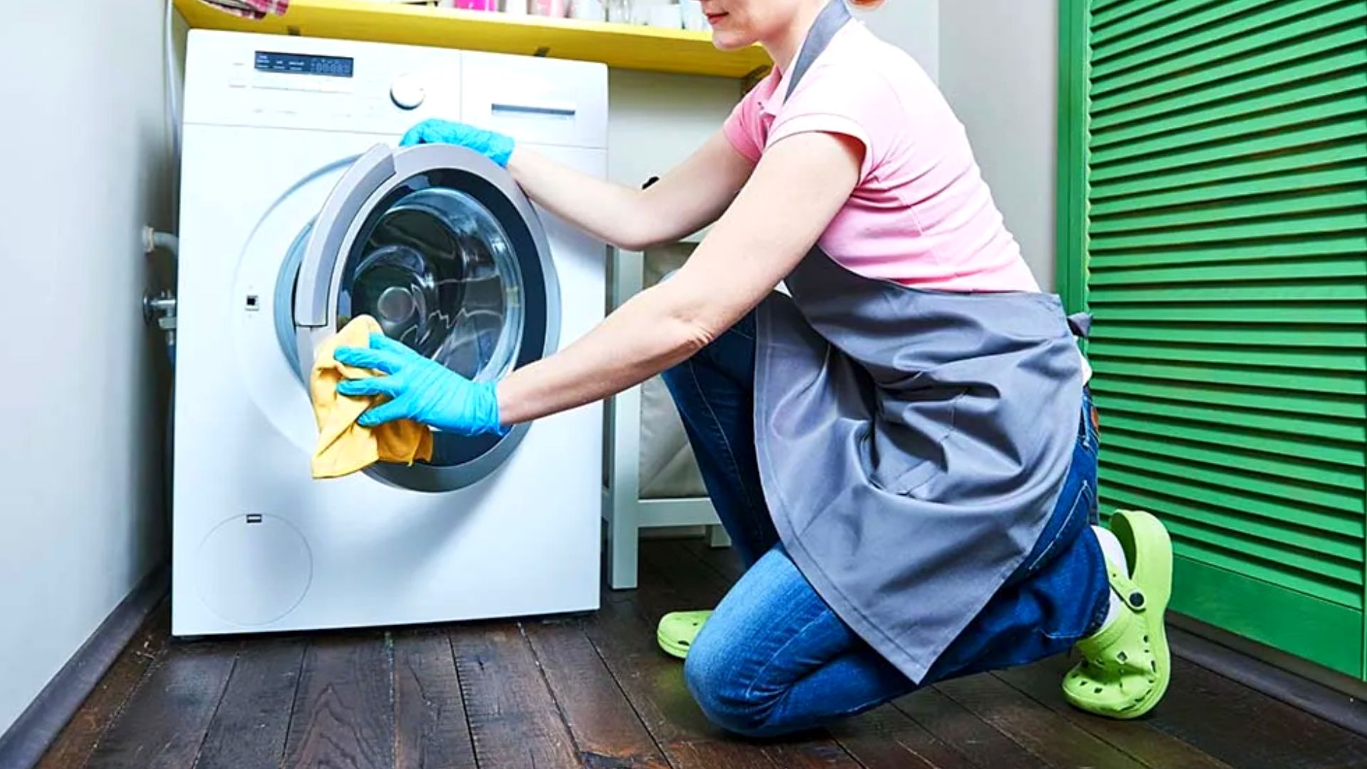 Woman Cleaning A Washing Machine.jpg