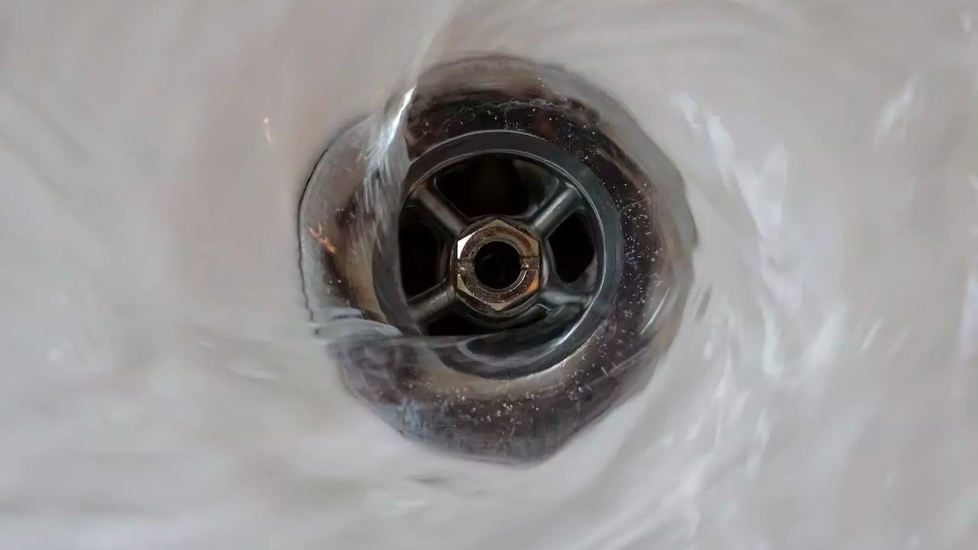 Water Spinning Down Drain
